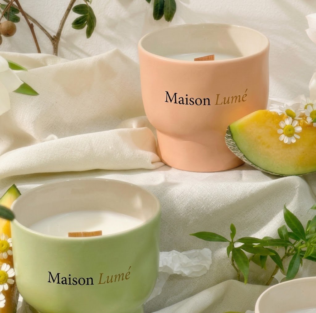 Ceramic candle vessels styled with linen and citrus